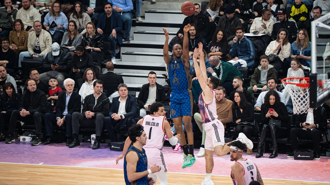 Melvin Ajinca (Saint-Quentin) scoring 3 points against Paris Basketball Melvin Ajinca (Saint-Quentin) scoring 3 points against Paris Basketball